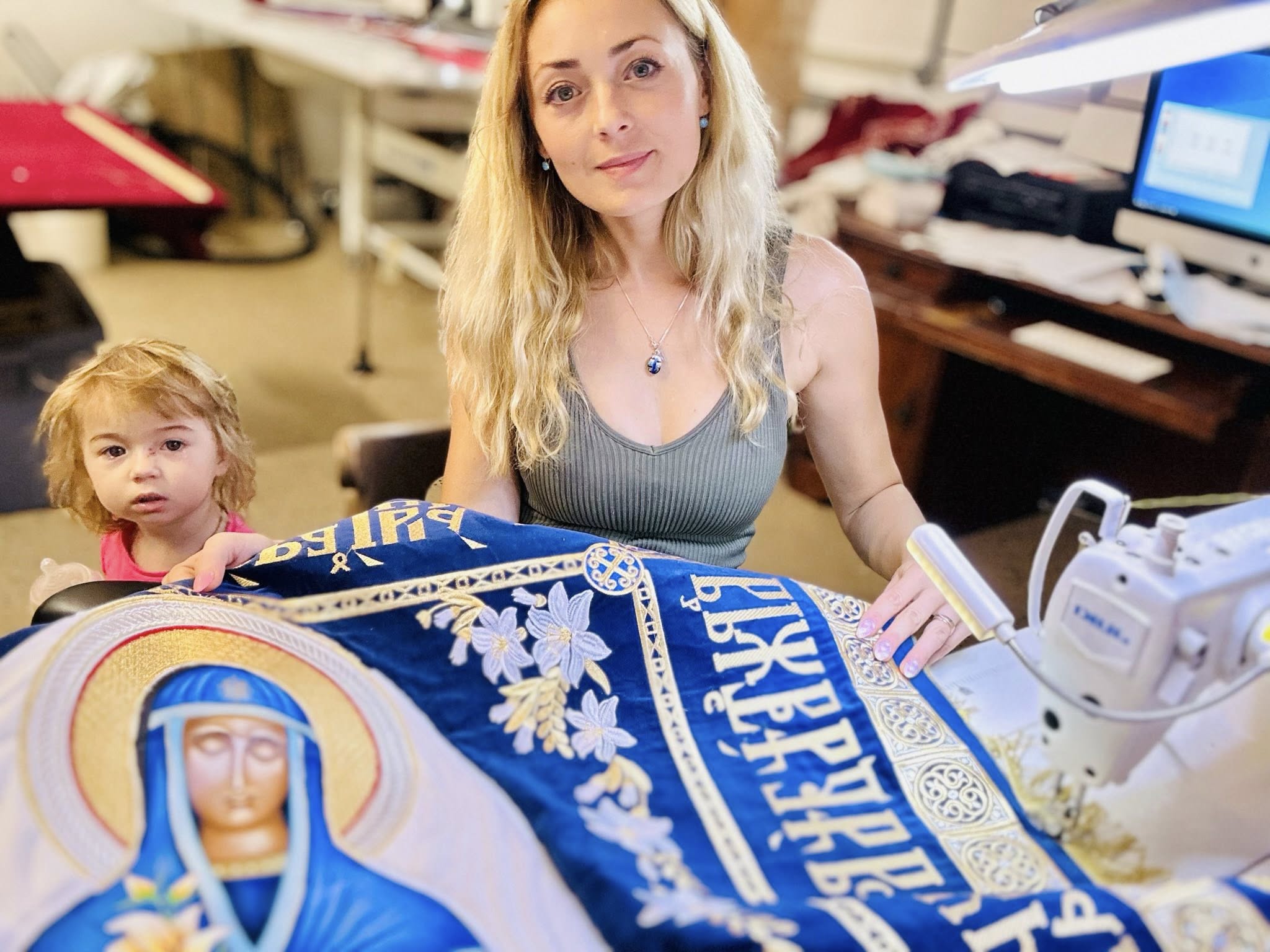 Yana with her daughter in the embroidery studio